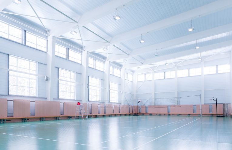 Emptry indoors tennis court in large sports hall