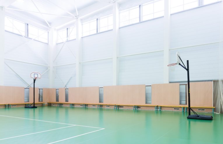 Emptry indoors tennis court in large sports hall